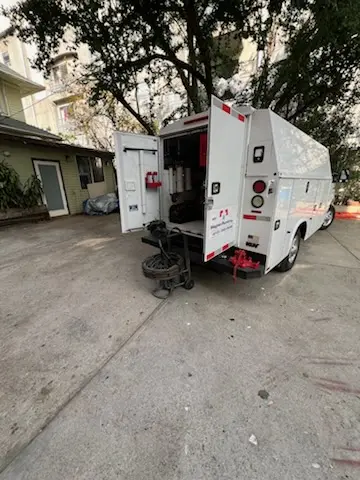 Magnet Plumbing service vehicle on-site for Sewer Line Repair in Woodlands